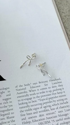 Angel Whisper Earrings^Velika Bow Earrings - Silver